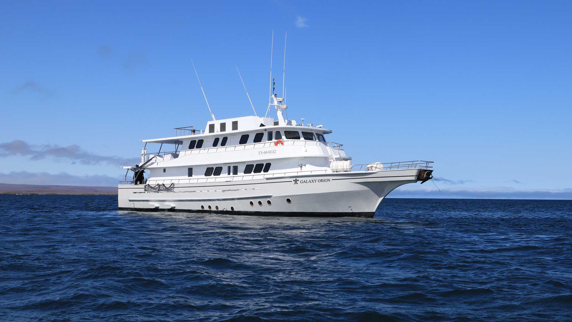 Galaxy Orion Exclusive Ship – Luxury Cruise in the Galapagos Exterior view of the Galaxy Orion Exclusive cruise ship sailing through the Galapagos Islands