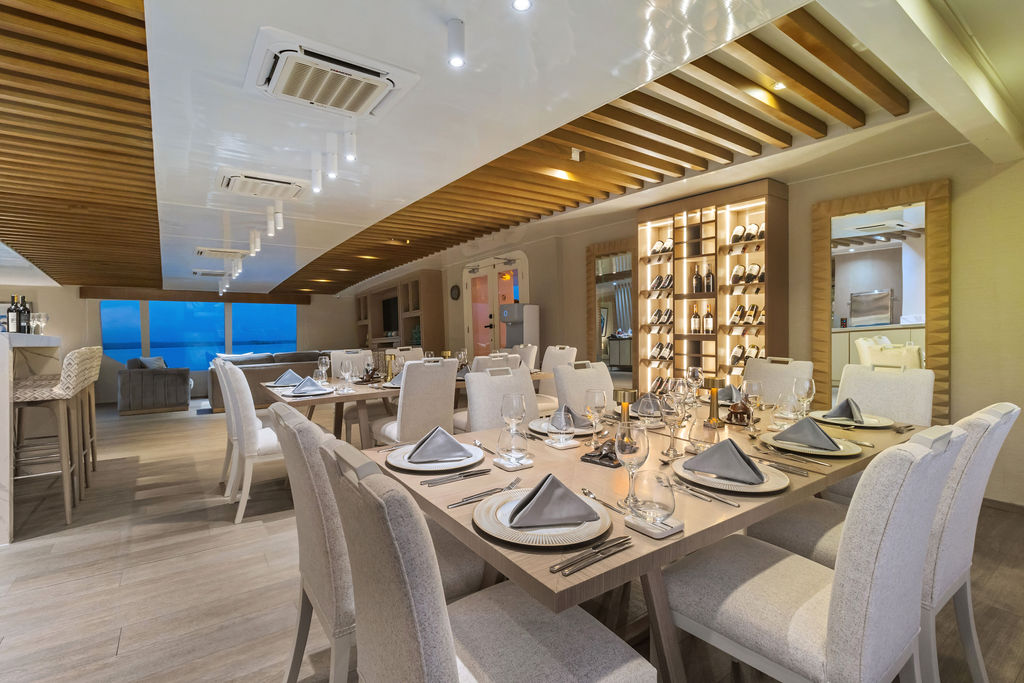 Dining Room - Endemic Cruise Dining area with panoramic windows aboard the Endemic catamaran