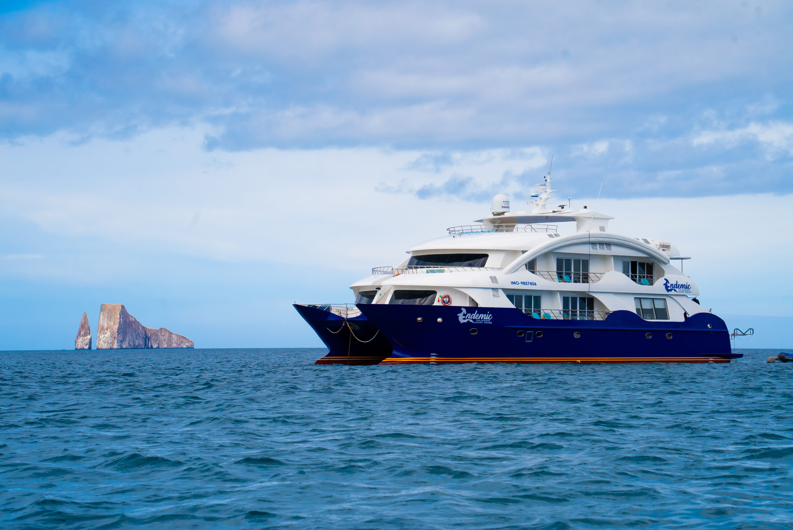 Endemic Catamaran Exterior View Endemic luxury catamaran navigating near the Galapagos Islands